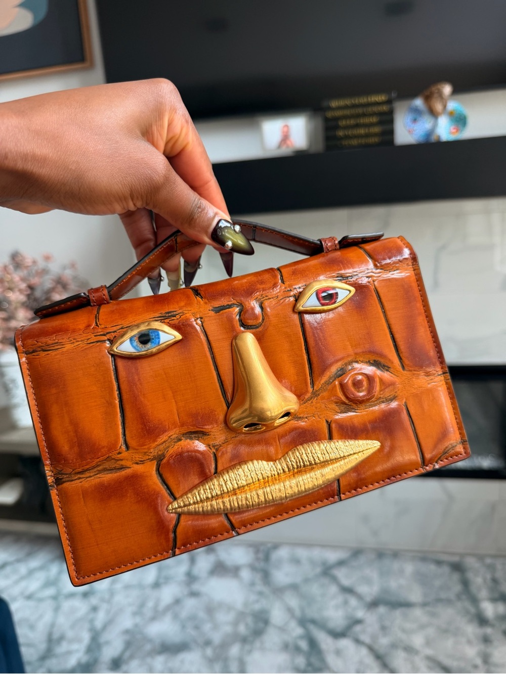 Schiaparelli leather face clucth